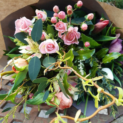 Ashleigh - A budding delight, complimented by greenery and presented in a gift box/bag. Beautiful flower bouquet hand delivered by the local florist.