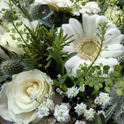 Evelyn - A fabulous collection of white and cream flowers make this the perfect gift. This bouquet will be hand delivered by the local florist.