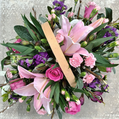 Bon Bon - Shower them with love with this cutesy collection of seasonal flowers in pretty pastels. Beautifully arranged and stylishly presented in a traditional basket.