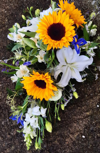 Spray - A teardrop shaped arrangement in a seasonal mix of blooms.  Let me know in 'special requests' if you'd like a particular colour and allow me a days notice please.