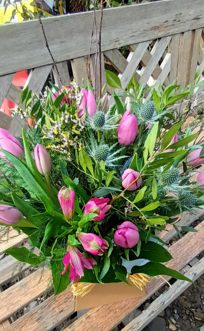 Purple Perfection - A profusion of tulips with a variety of foliage and other complementary blooms....presented in a handtied box.